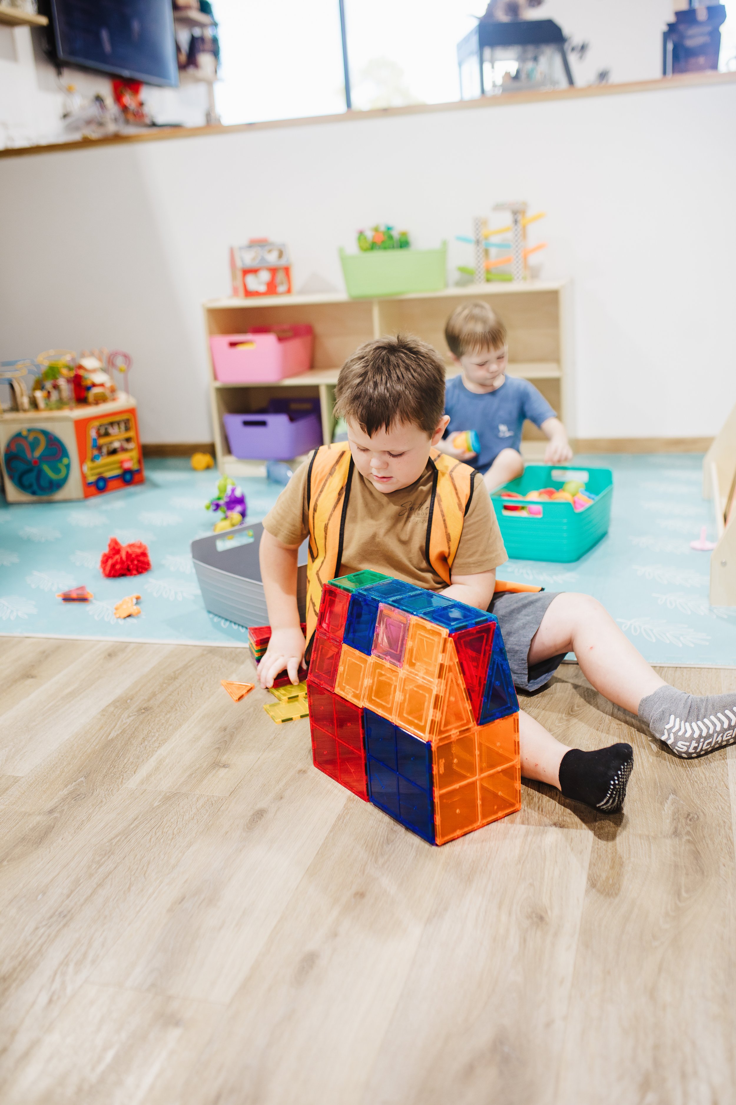 Children building together during playtime at Little Peaches.