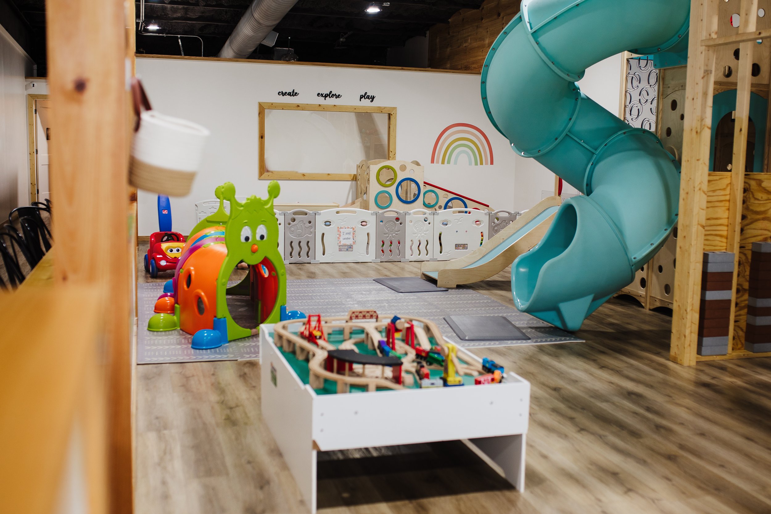 Little Peaches play space with slides and imaginative play areas.